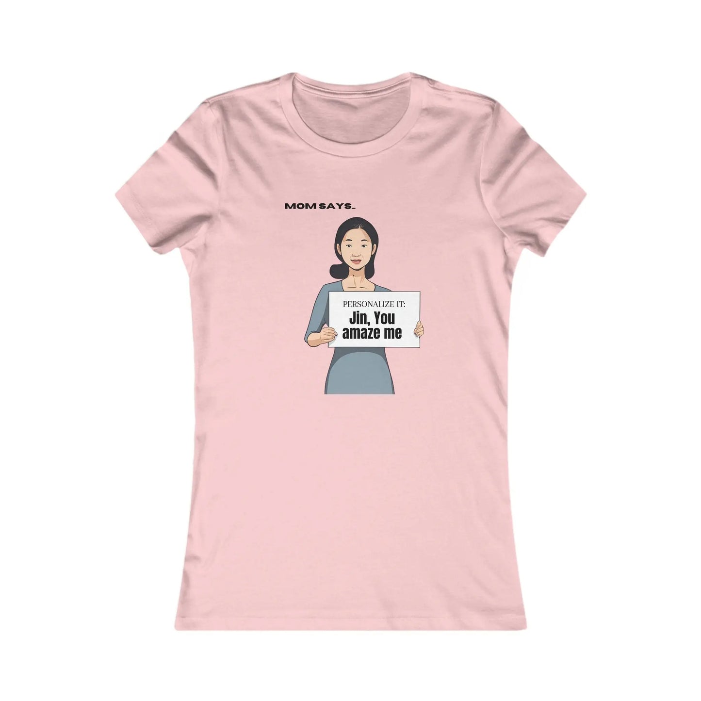 A pink t-shirt adorned with a cartoon and personalizable text. The current text says "Jin, you amaze me". The shirt is set against a plain white background.