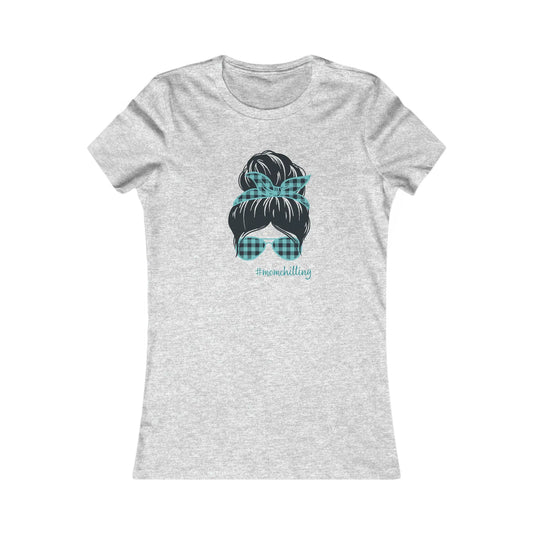 You have found the perfect gift at the Gifts For Mom store: a heather grey t-shirt adorned with an illustration of a womans hair in a bun, accented by a blue and black checkered print bandana and matching sunglasses. Embrace #MOMCHILLING with this charming design!.