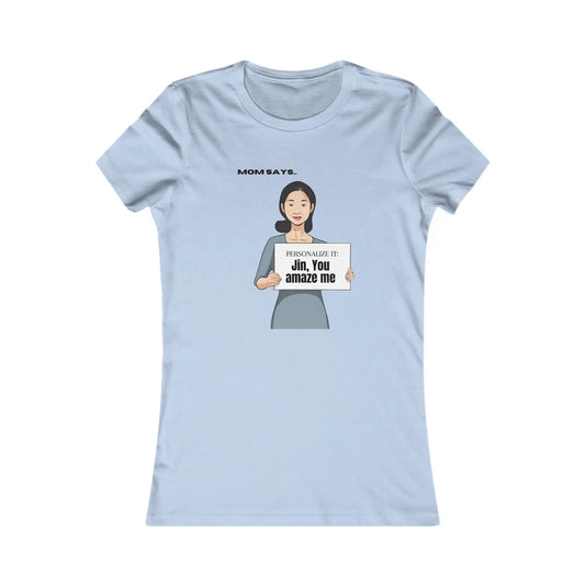 A baby blue t-shirt adorned with a cartoon and personalizable text. The current text says "Jin, you amaze me". The shirt is set against a plain white background.