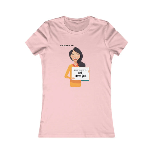 A personalizable pink T-shirt with a cartoon and the text Mom says, Kai, I love you. Its the perfect find from Gifts For Mom store, set against a plain white background.