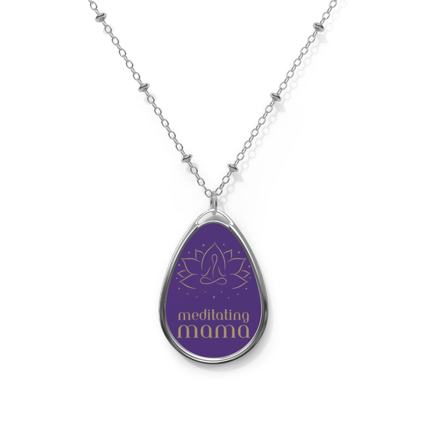 This delicate silver necklace from the Gifts for Mom store showcases a teardrop-shaped pendant with a purple background. It features a simple line drawing of a person meditating, and the words meditating mama beneath it, perfect for the love of meditation.