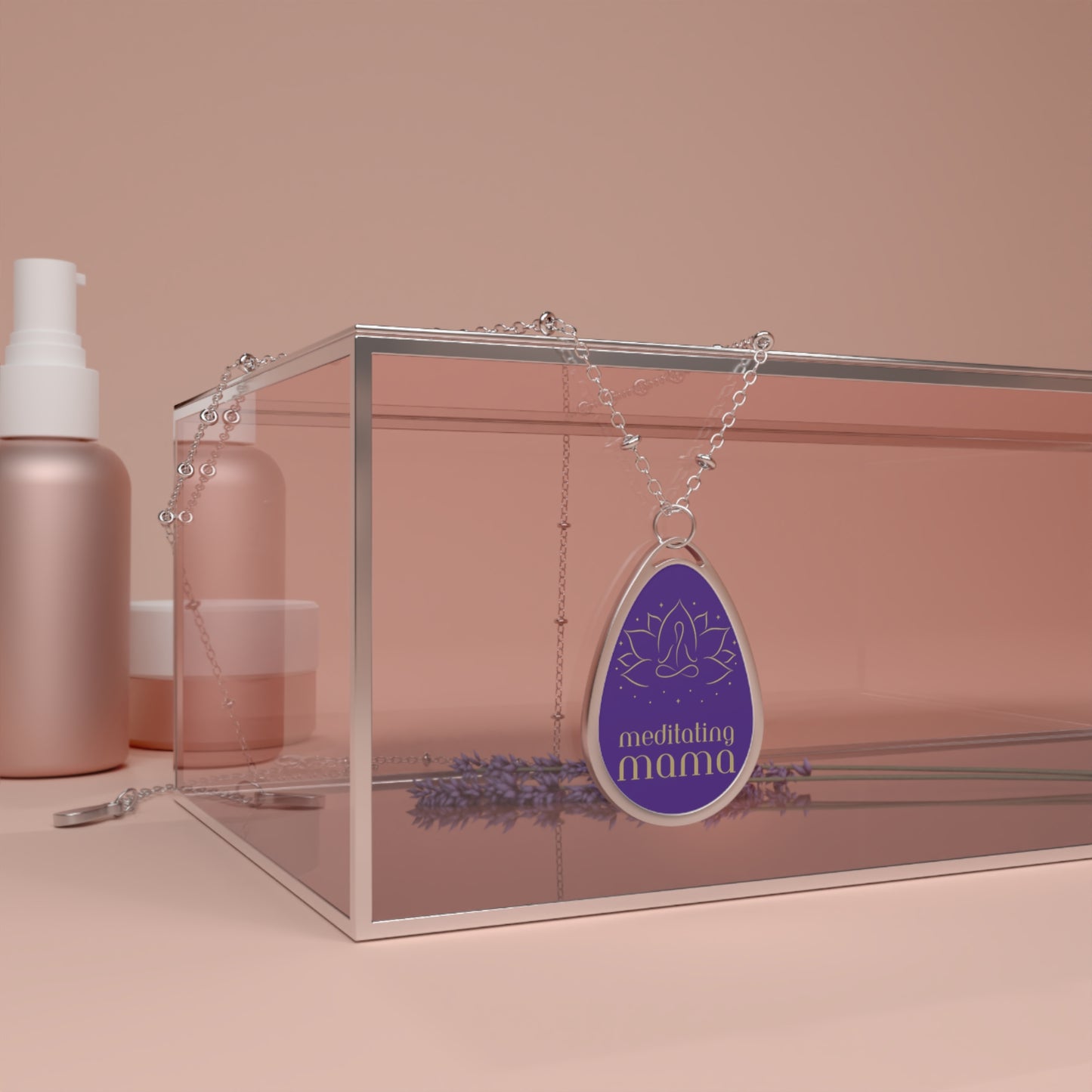 This delicate silver necklace from the Gifts for Mom store showcases a teardrop-shaped pendant with a purple background. It features a simple line drawing of a person meditating, and the words meditating mama beneath it, perfect for the love of meditation.