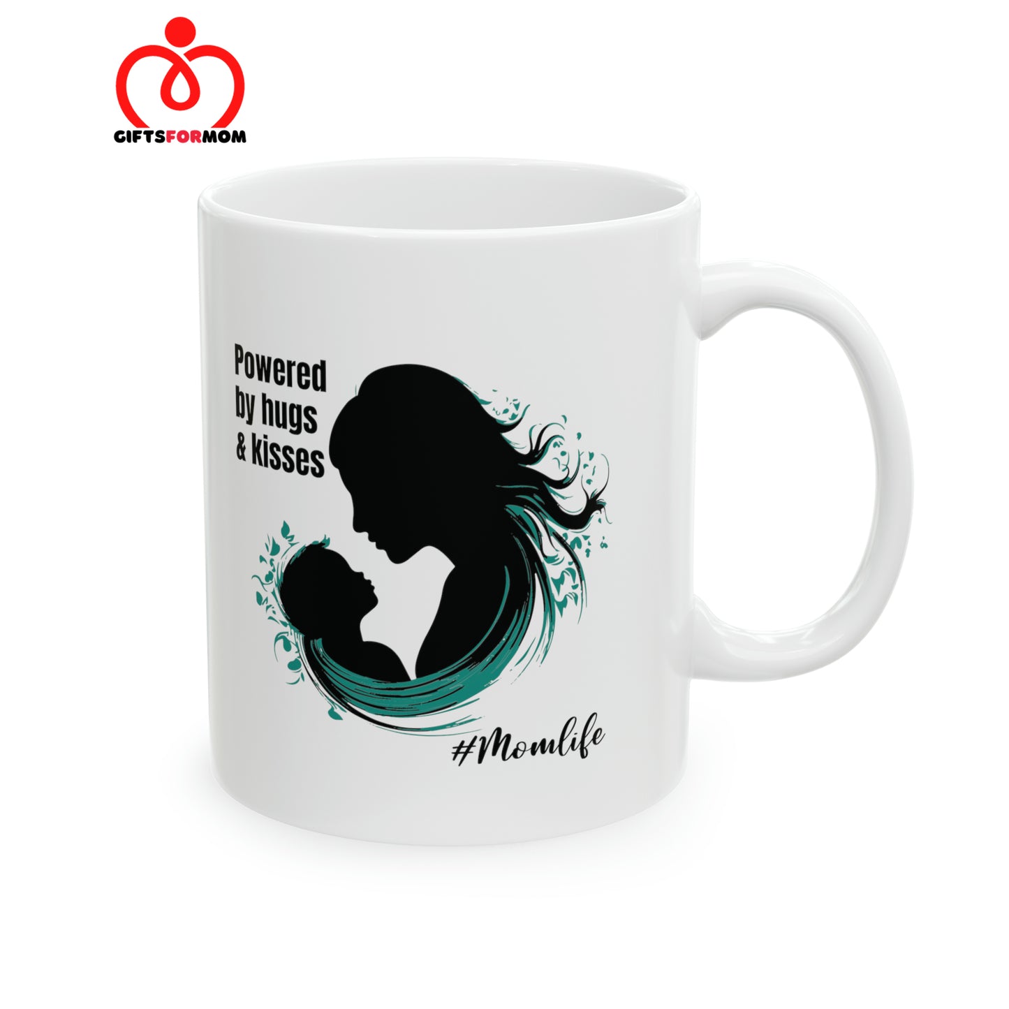 A white coffee cup from the Gifts For Mom store, featuring a silhouette of a woman and child alongside the text Powered by hugs & kisses. The hashtag #Momlife is below the image.