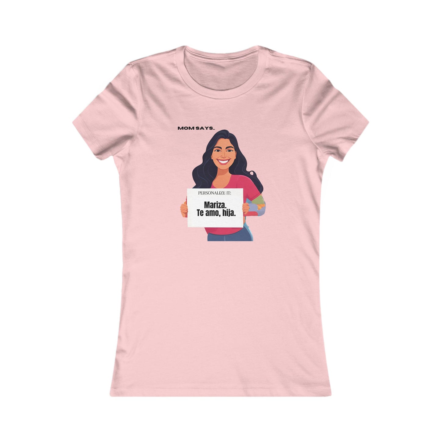 Personalizable pink t-shirt from the Gifts For Mom store, featuring a woman holding a sign that reads Personalized it: Mariza, Te amo, hija. Above her, text says Mom Says. Perfect for those seeking unique gifts where se habla español.
