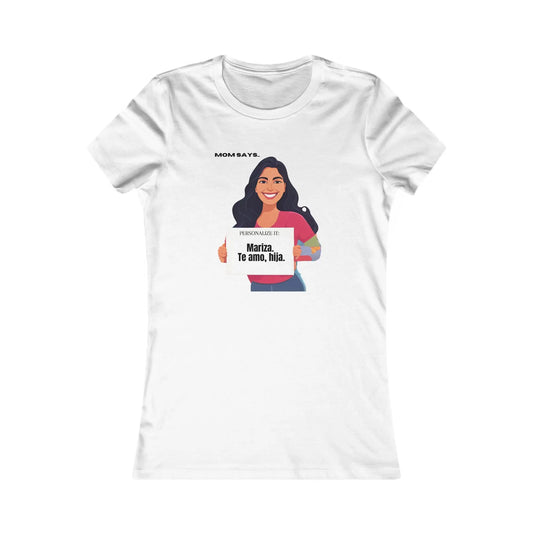 Personalizable white t-shirt from the Gifts For Mom store, featuring a woman holding a sign that reads Personalized it: Mariza, Te amo, hija. Above her, text says Mom Says. Perfect for those seeking unique gifts where se habla español.