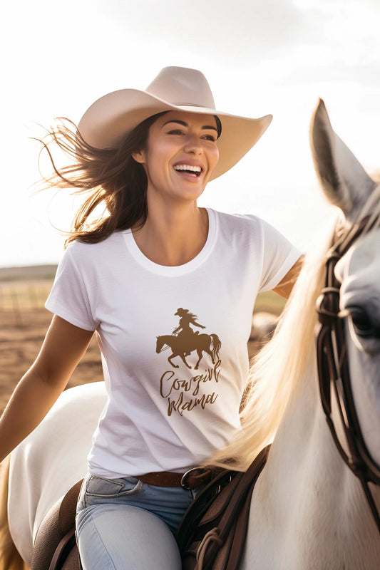 Woman wearing a cowgirl hat and a white t-shirt that reads Cowgirl Mama