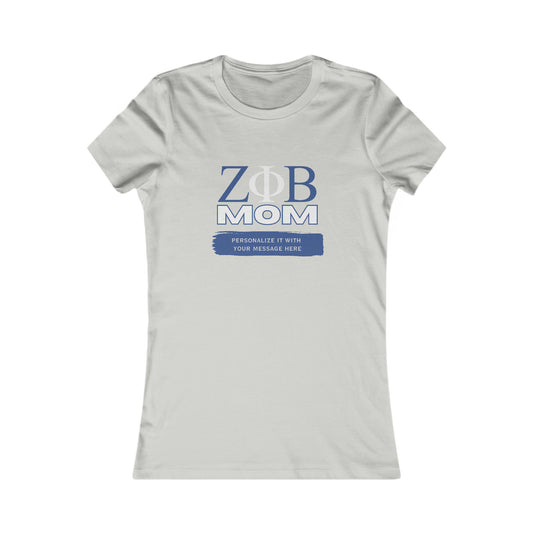 Grey t-shirt with the symbols for Zeta Phi Beta MOM printed in blue and grey on the front. Ideal for celebrating Mom, it features a placeholder below for customization: PERSONALIZE IT WITH YOUR MESSAGE HERE in white on a blue background. Available now at the Gifts For Mom store.