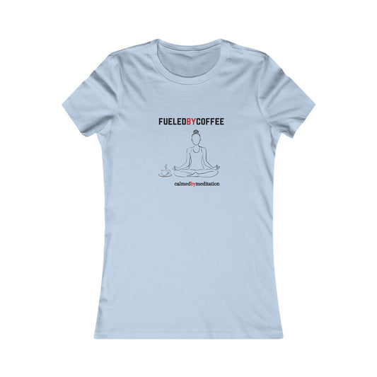 A sky blue t-shirt from the Gifts For Mom store showcases a simple line drawing of a person meditating, flanked by coffee cups. Text above reads FUELED BY COFFEE and below reads calmed by  meditation—perfect for celebrating mom’s love for peace and caffeine.