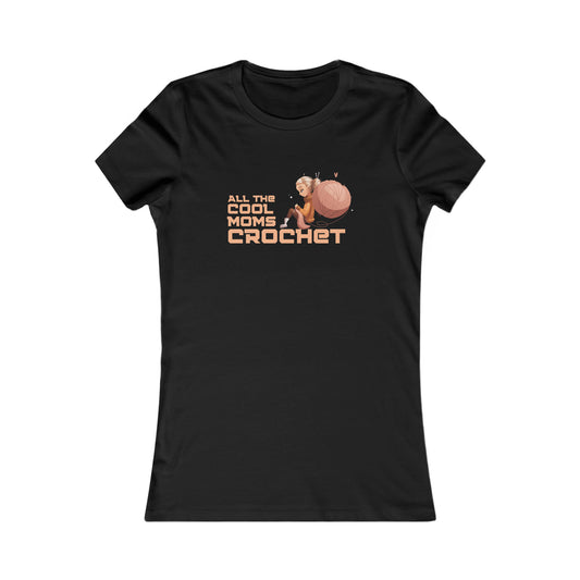 Celebrate moms who crochet with this black T-shirt from the Gifts For Mom store, featuring ALL THE COOL MOMS CROCHET and a charming illustration of a woman seated beside a large ball of yarn with a crochet hook.